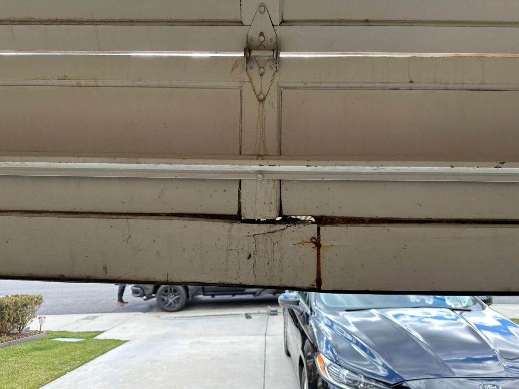 broken garage door panel